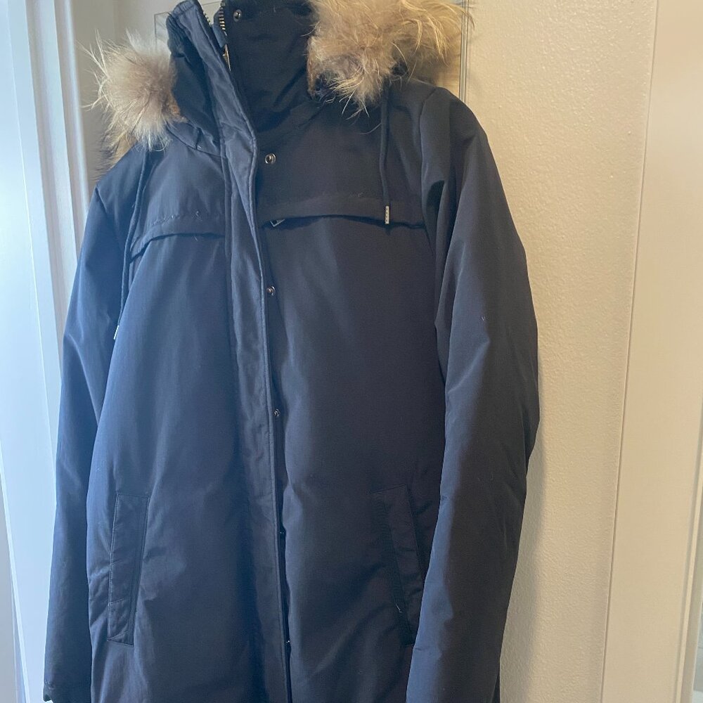 Fur and down black winter coat by Danish brand MINIMUM